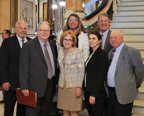 McLean County rural officials traveled to Springfield to oppose the proposed expansion of the local airport authority. Back row (from left): Dr. Cathy Weber, Mayor of Cooksville; Todd Zalucha, Mayor of Heyworth Front row: Spencer Johansen, Mayor of Lexington; Allen Grussing, Mayor of Bellflower; Catherine Metsker, White Oak Township Supervisor; Anna Ziegler, McLean County Farm Bureau Assistant Manager; Jim Fraley, Martin Township Supervisor