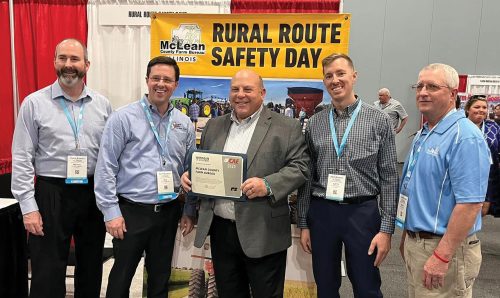 American Farm Bureau Federation President, Zippy Duvall (center) presented McLean County Farm Bureau with a County Activity of Excellence Award for Rural Route Safety Days. From left: Michael Swartz, manager; Reid Thompson, board member; Austin O’Neall; board member; and Brian Dirks, President accepted the award.