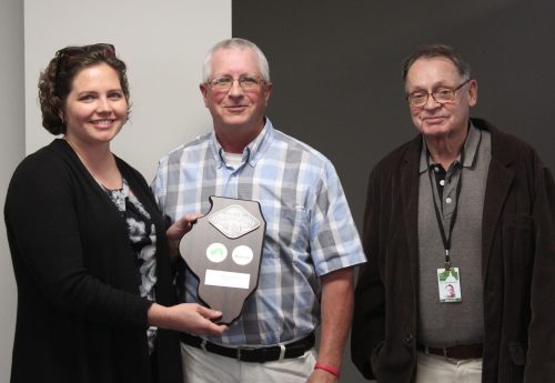 McLean County Farm Bureau President, Brian Dirks (center) presented an Ally in Agriculture plaque to McLean County Board Vice Chair, Elizabeth Johnston (left) and McLean County Board Chair John McIntyre at the June Executive committee meeting.