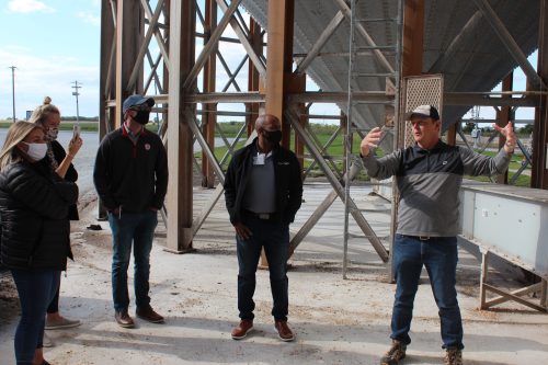 Evergreen FS Grain Department Manager, Todd McTaggert (right), explains the grain drying process to Ag Day participants.