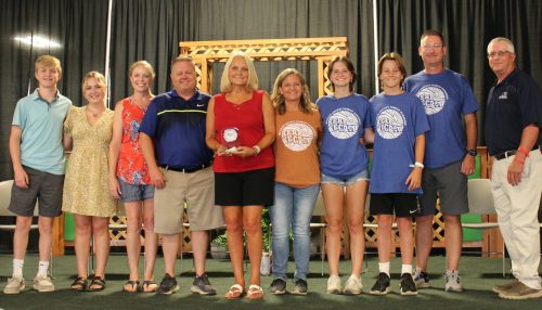 Members of the Mike Mouser family received an Emerald Clover award in his honor.