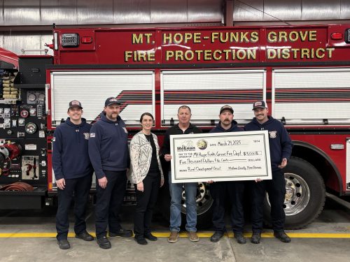 McLean County Farm Bureau presents Rural Development Grant funds to the Mt.Hope-Funks Grove FPD. Pictured (left to right) Firefighter/EMR R. McCallister, Firefighter/EMT E. Smith, McLean County Farm Bureau Manager Anna Zeigler, McLean County Farm Bureau Vice President Darren Davis, Assistant Chief J. Crowell and Firefighter/EMR R. Brown